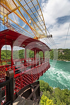 The Whirlpool Aero Car taking tourists and visitors for a ride over the whirlpool of the Niagara River. Niagara Falls, Ontario, Ca