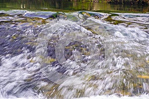Whirlpools and small waterfalls in O Rosal, Galicia Spain photo
