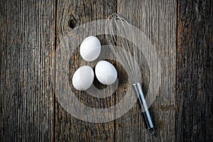 Whisk or Egg Whisk and Three White Eggs