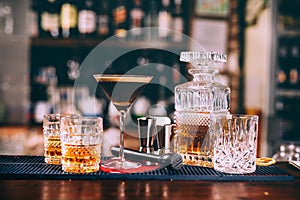 whiskey based cocktails, alcoholic beverages in modern bar