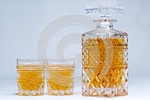 Whiskey bottle and gases isolated on white background