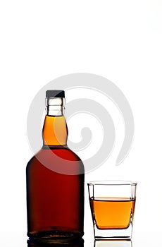 Whiskey bottle and glass