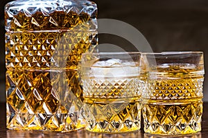 Whiskey bottle and glasses with black background