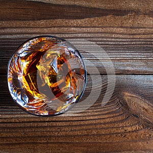 Whiskey, bourbon, brandy, or cognac on log table