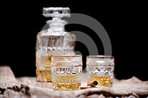 Whiskey crystal bottle and glasses with alcoholic booze photo
