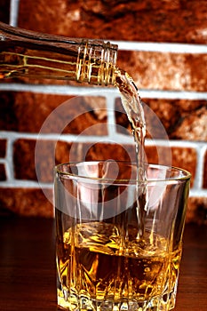 Whiskey glass on brick