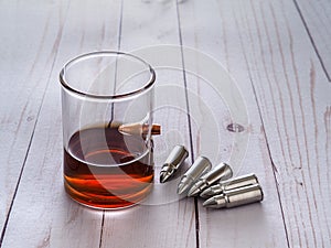 Whiskey glass with bullet