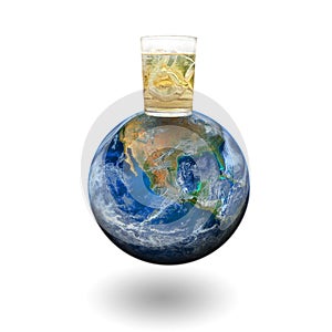 A whiskey glass on the earth. Elements of this image furnished by