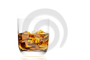 Whiskey glass with ice cubes.