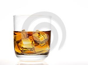 Whiskey glass with ice cubes.