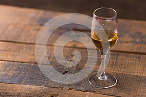 whiskey in glass on wood background
