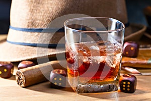 Whiskey with ice and cigar