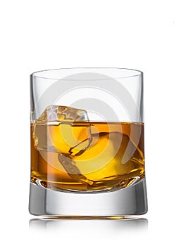 Whiskey with ice cube in crystal glass on white background. Irish,scotch and bourbon