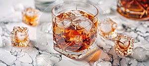 Whiskey on the rocks glass with ice cubes on simple background with space for text