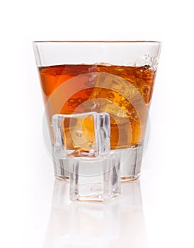 Whiskey splash with ice cubes isolated on white