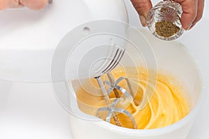 Whisking eggs and adding ingredients