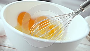 Whisking Eggs for Cake or Omelet in White Bowl with Egg Beater in 1000 FPS (Phantom Flex)