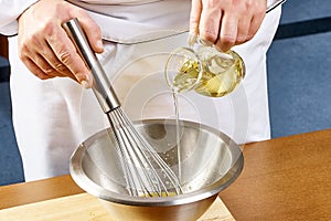 Whisking vigorously to disperse oil Making Mayonnaise oil