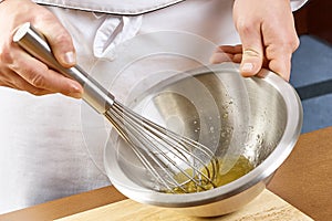 Whisking vigorously to disperse oil Making Mayonnaise oil