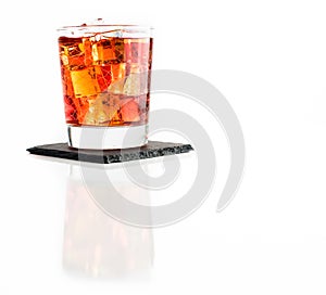 Whisky on rocks isolated on white background