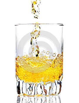 Whisky,rum or any other golden liquor being poured