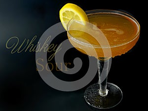 A whisky sour in a coupe glass with a lemon wagon wheel garnish. Text added.