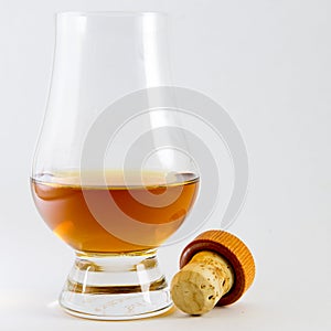 Whisky in a whiskey glass with a cork