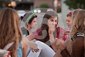 Whispering Teen Female with Friends