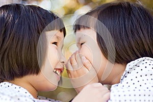 Whispering twin girls