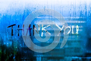 Whispers of Gratitude: Thank You Words Written on Rain-Kissed Window Glass