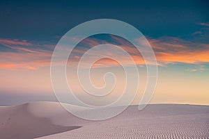 Whispy Pastel Clouds At Sunset Over White Sands