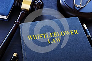 Whistleblower law book and gavel.