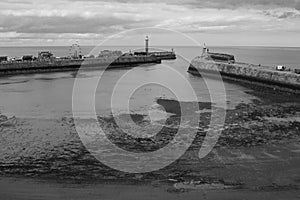 Whitby pier in black and white