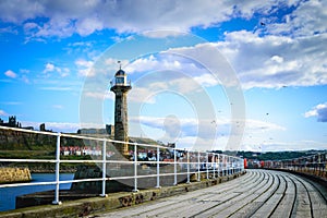 Whitby pier at the harbor entrance at Whitby in North Yorkshire, UK