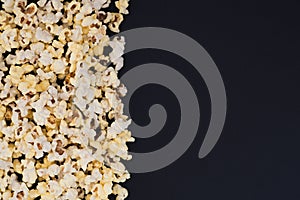 White 3d glasses,metal can with a drink, popcorn on a black background, top view, copyspace