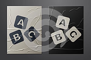 White ABC blocks icon isolated on crumpled paper background. Alphabet cubes with letters A,B,C. Paper art style. Vector