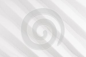 White abstract rippled smooth background with diagonal lines.