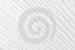 White abstract striped plaster background.