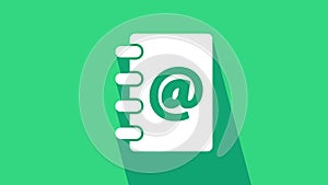 White Address book icon isolated on green background. Notebook, address, contact, directory, phone, telephone book icon