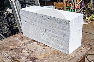 White aerated concrete block, brick close-up. Laying aerated concrete blocks.