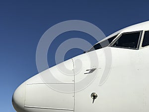 White Aeroplane Nose against clear Blue Sky 2