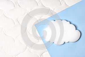 White air cloud on a comfortable mattress texture background and blue background top view. White texture of mattress bedding