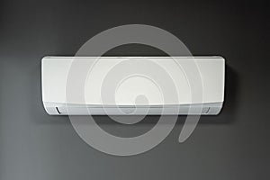 White air conditioning on a gray wall background. The concept of heat, cool air, cooling, freshness