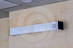 A white air conditioning unit mounted on a wall