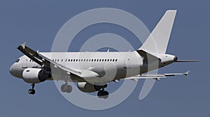 White aircraft on the blue sky background
