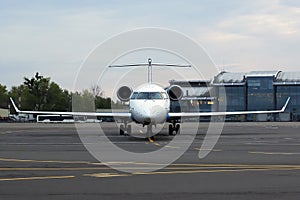 White aircraft on the parking zone