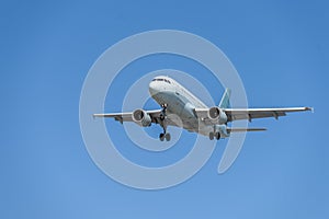 Airplane flying under the sky.