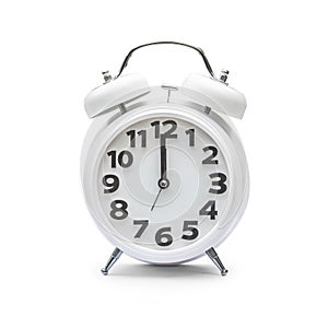 White alarm clock at 12.00 twelve o`clock, noon isolated on white background clipping path