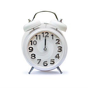 White alarm clock at 12.00 twelve o`clock, noon isolated on white background clipping path