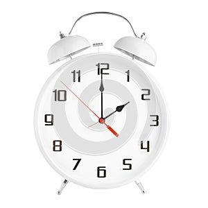 White alarm clock showing two o`clock isolated on white background